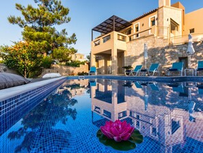 Seasonal outdoor pool, pool umbrellas, pool loungers