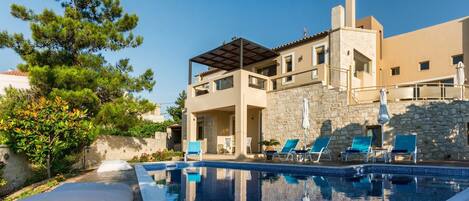 Seasonal outdoor pool, pool umbrellas, pool loungers