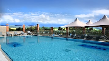 Indoor pool, seasonal outdoor pool, open 7:30 AM to 9 PM, pool loungers