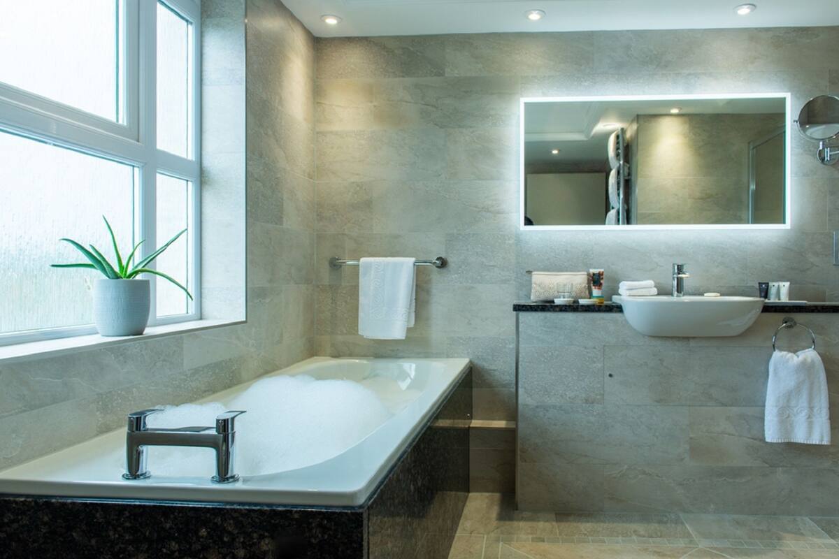 deep-soaking bathtub, free toiletries, hair dryer, bathrobes