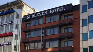 A hotel named GURLEYEN HOTEL with a modern facade, multiple floors, and a visible entrance. - Gurleyen Apart Otel (Izmir)