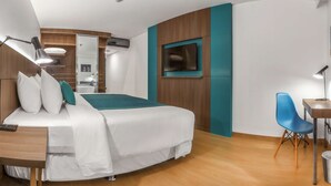 A modern hotel room with a bed, desk, chair, and a TV mounted on the wall. - Libre Hotel, BW Signature Collection (Lima)