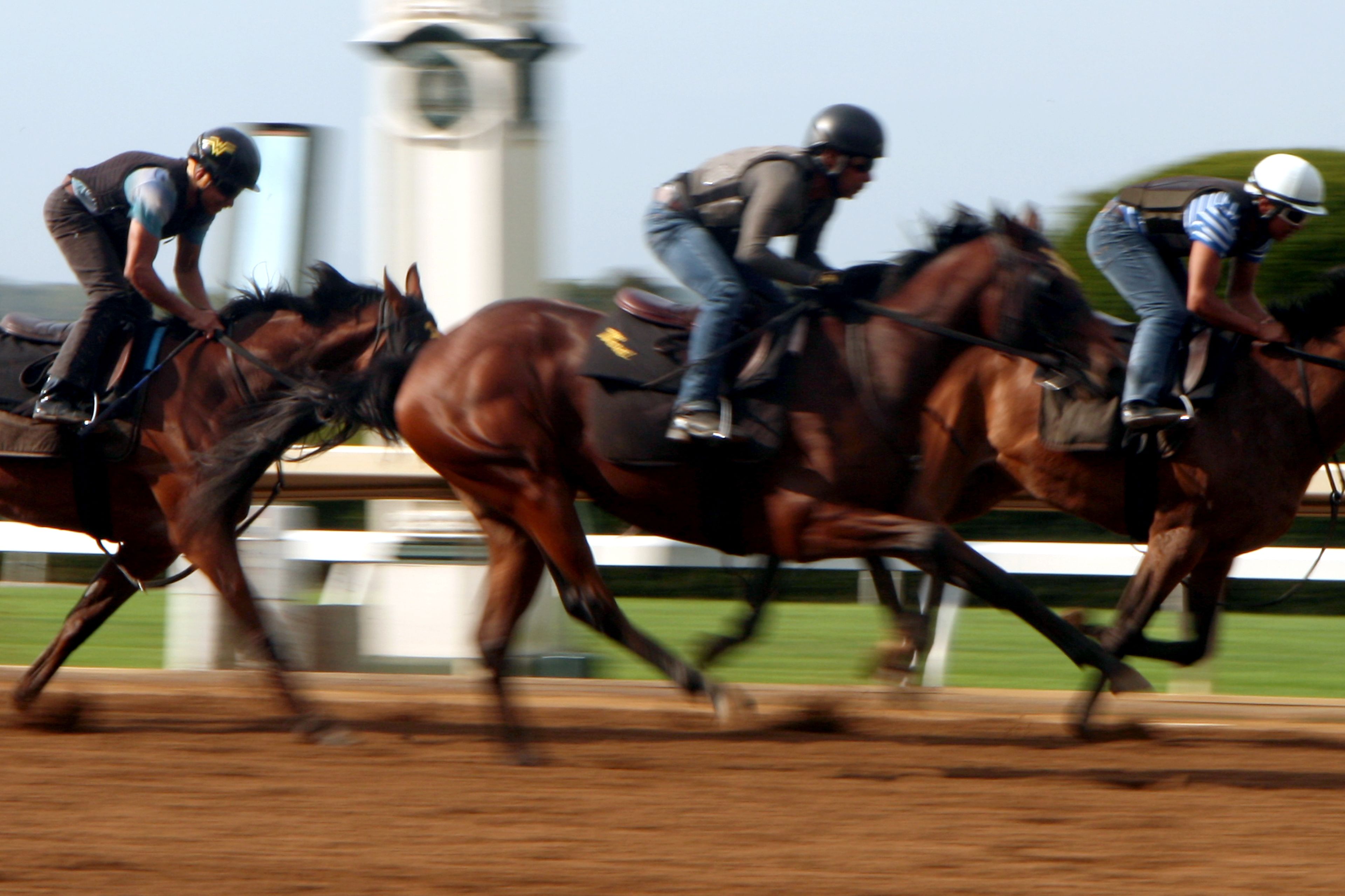 A horse race with jockeys on horses.