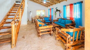 Deluxe Villa, 6 Bedrooms | Living area | 32-inch Smart TV with digital channels