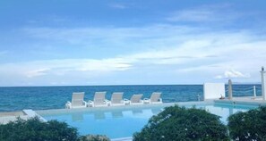 Outdoor pool, open 7:00 AM to 10:00 PM, pool loungers - Seascape Resort Oslob (Oslob)