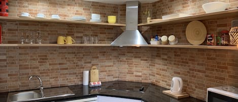 Fridge, microwave, stovetop, coffee/tea maker