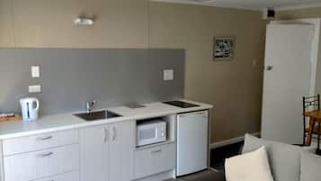 Medium Family Cabin | Private kitchen | Fridge, microwave, coffee/tea maker, electric kettle