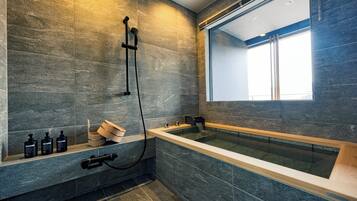 Separate bathtub and shower, slippers, towels