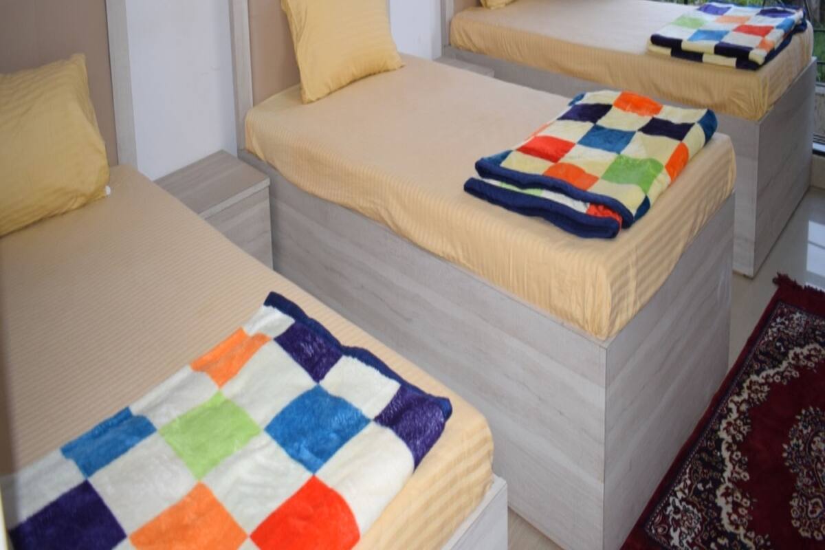 Habitación triple superior | Sábanas de algodón egipcio y camas con efecto memoria