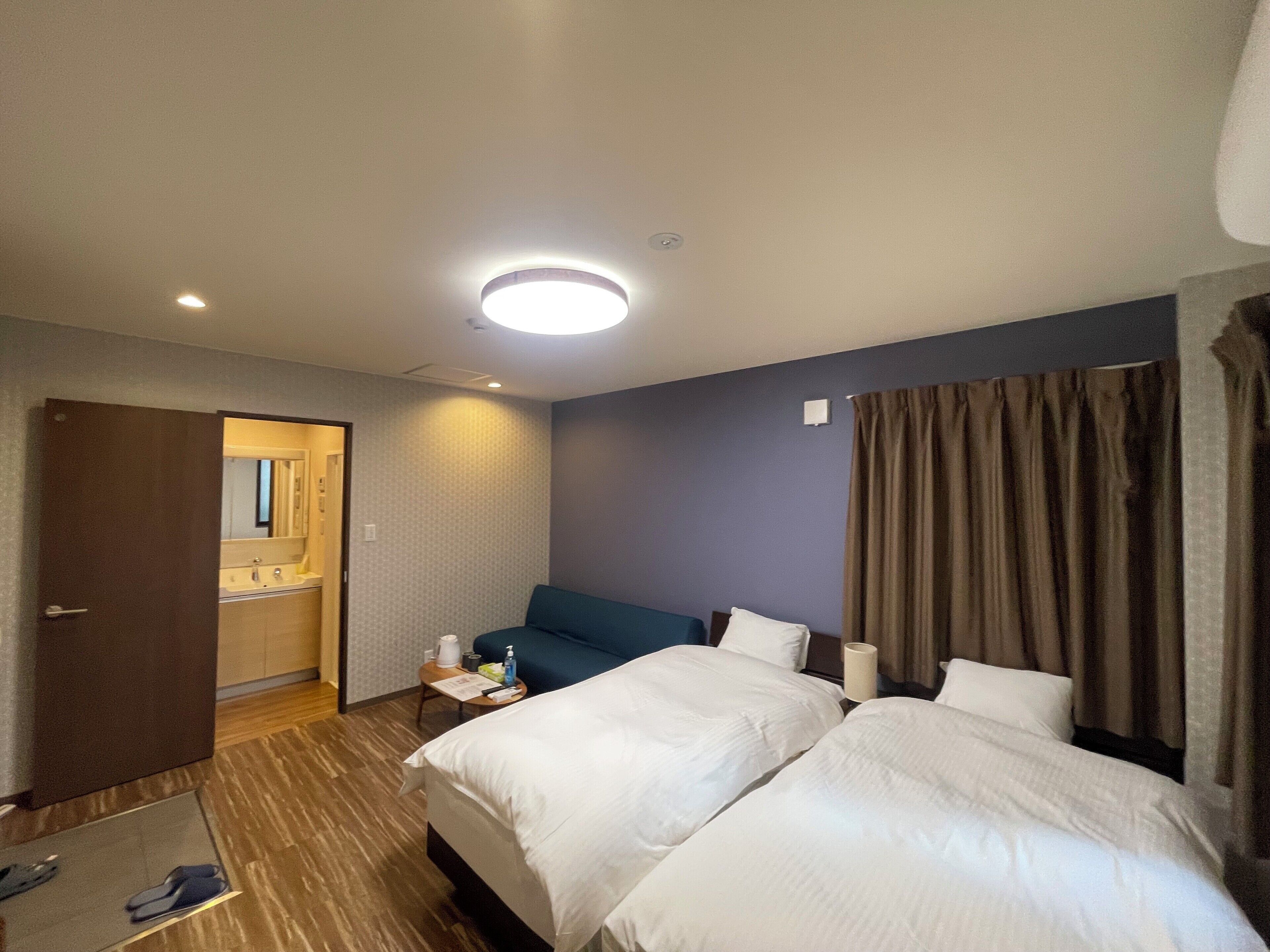 Twin room with sofa bed | Desk, blackout drapes, iron/ironing board, free WiFi