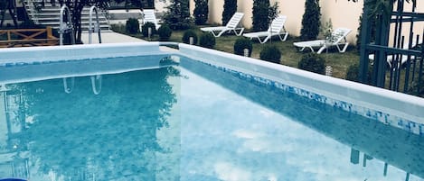 Outdoor pool, open 8:00 AM to 11:30 PM, sun loungers