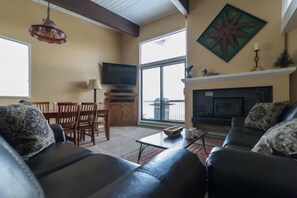 Apartment | Living area | TV, fireplace