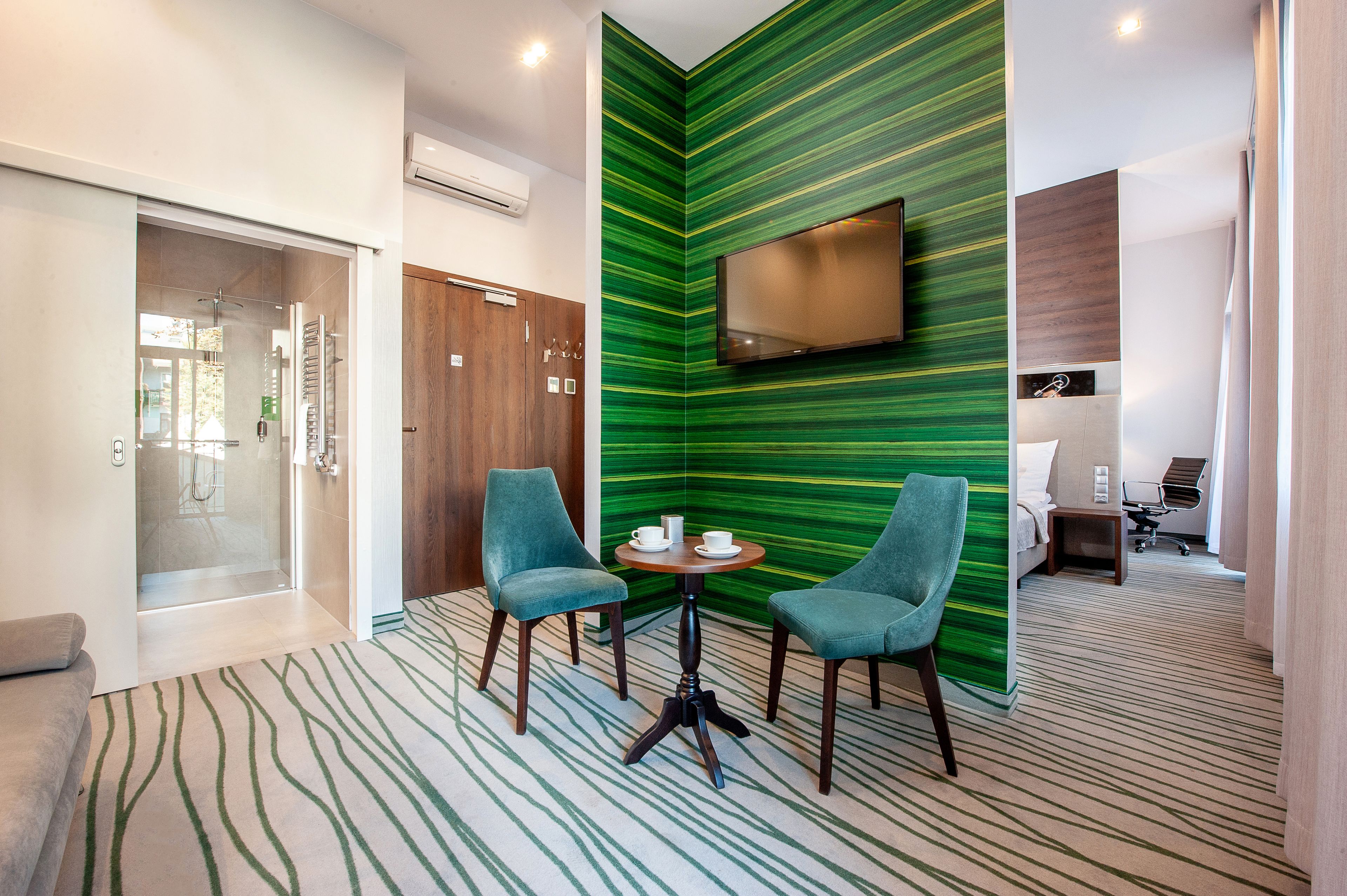 deluxe double room | living room | 40-inch flat-screen tv with satellite channels, tv