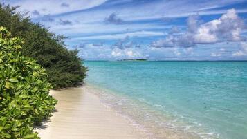 Beach nearby, white sand, sun loungers, beach umbrellas