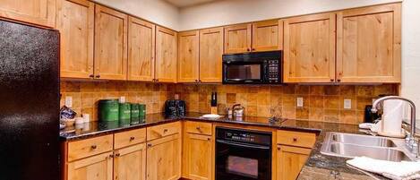 Apartment | Private kitchen | Fridge, microwave, stovetop, dishwasher