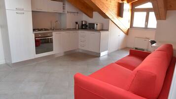 Apartment, 1 Bedroom | Living area | Flat-screen TV