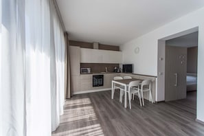 Apartment, 1 Bedroom | Private kitchen | Full-size fridge, microwave, oven, stovetop - Residenza Decimina (Perledo)