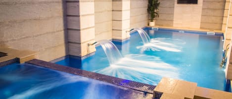 Indoor pool, open 9 AM to 10 PM, pool loungers
