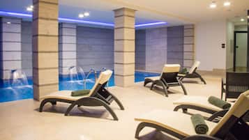 Indoor pool, open 9 AM to 10 PM, pool loungers