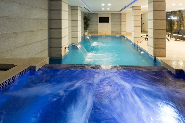 Indoor pool, open 9 AM to 10 PM, pool loungers