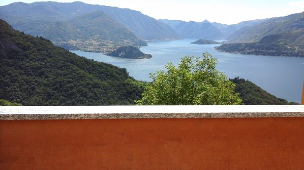 A mountainous landscape with a lake and a town in the valley.