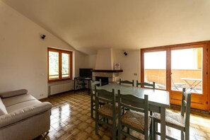 Family Apartment, 1 Bedroom, Kitchen, Lake View | Living area | Flat-screen TV - Bologna House (Perledo)