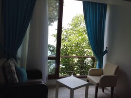 Comfort Double Room, 1 Queen Bed, Sea View | Living area | Flat-screen TV