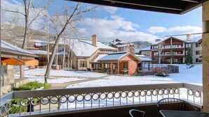A snow-covered outdoor area with a patio, a dining table, and chairs. - 1107 Trappeur's Lodge, Trappeur's Crossing Apartment 1 (Steamboat Springs)