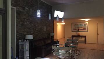 Apartment, 3 Bedrooms | Living area | Flat-screen TV