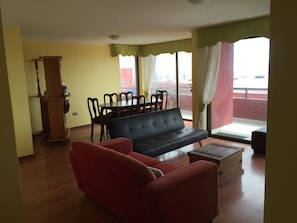 Apartment, 3 Bedrooms | Living area | Flat-screen TV