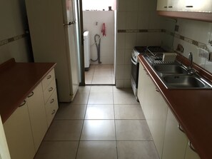 Apartment, 3 Bedrooms | Private kitchen | Fridge, oven, stovetop, cookware/dishes/utensils