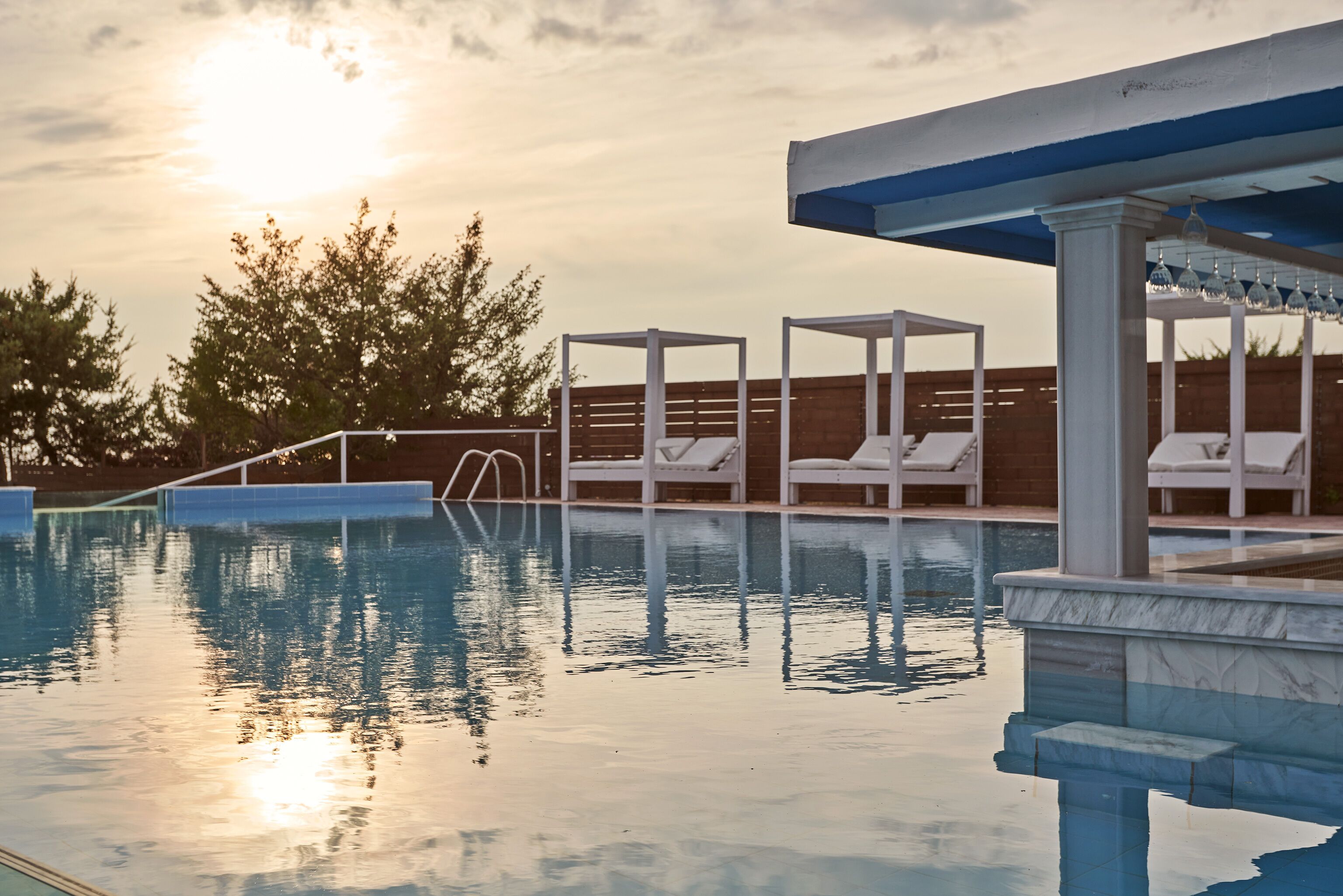 Seasonal outdoor pool, open 10:00 AM to 6:00 PM, pool umbrellas