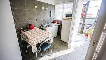 Fridge, microwave, electric kettle, cookware/dishes/utensils