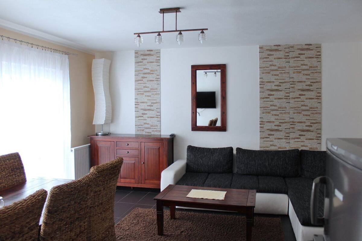 Deluxe Apartment, 2 Bedrooms | Living room | Flat-screen TV
