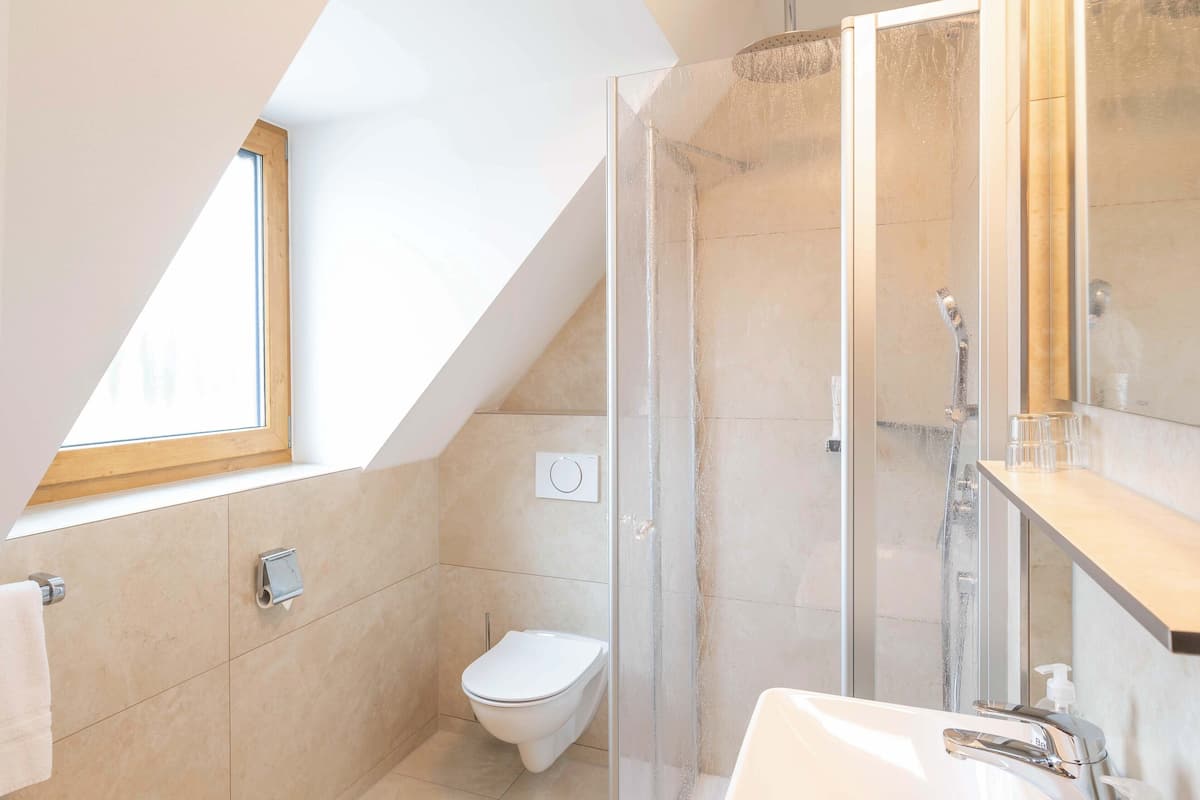 shower, rainfall showerhead, hair dryer, towels