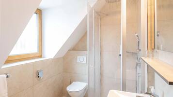 Shower, rainfall showerhead, hair dryer, towels