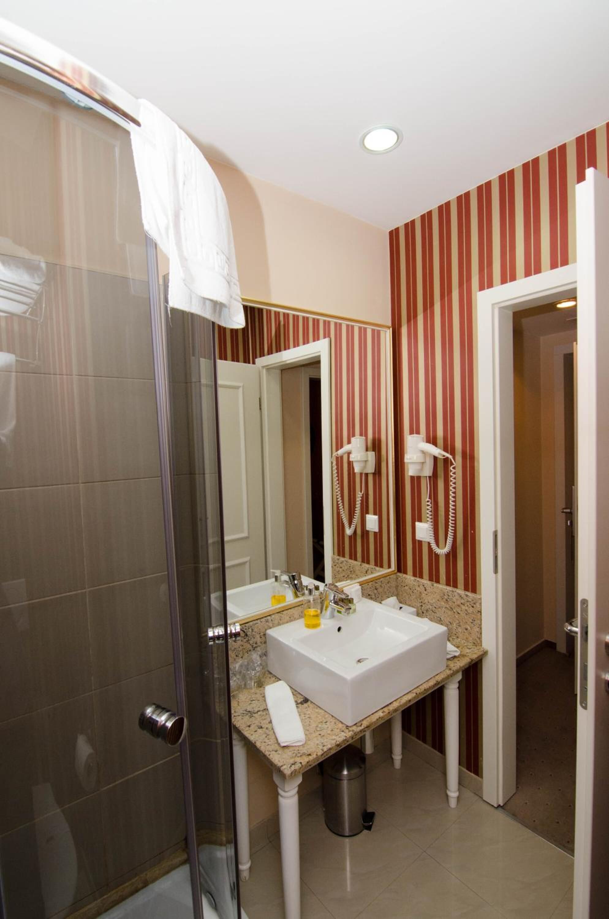 shower, free toiletries, hair dryer, slippers