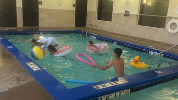 Swimmers can enjoy the pool's depth markers and easy access via the ladder.