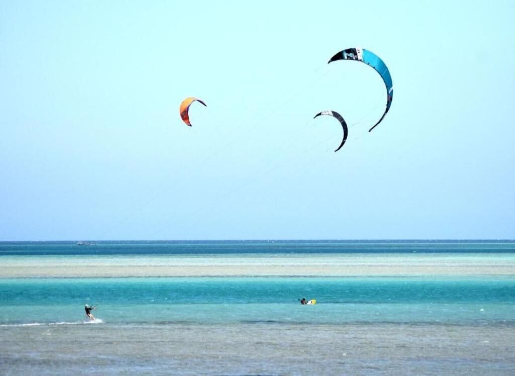 A beach with clear skies and calm waters.