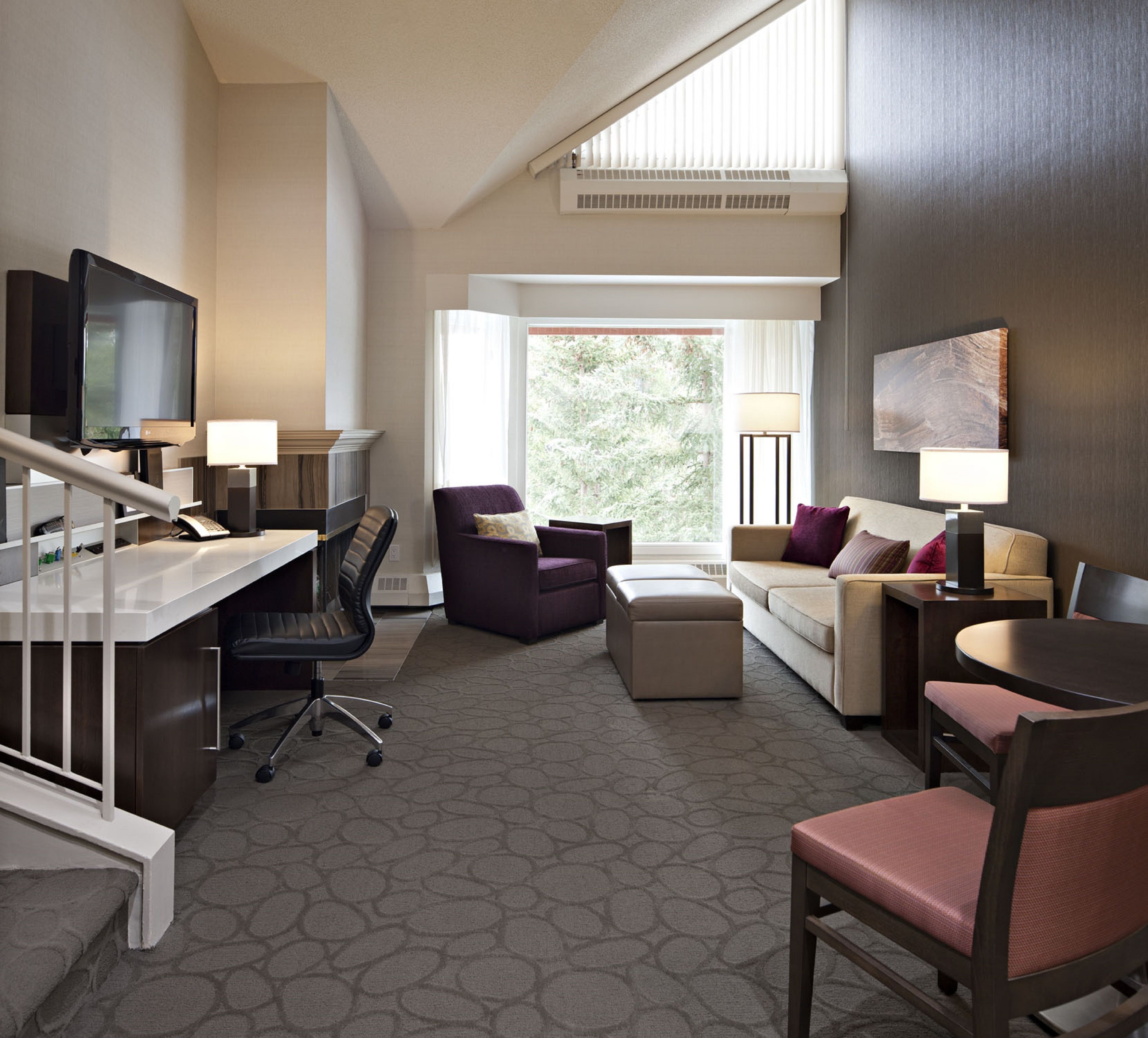 loft, 1 king bed with sofa bed, 2 bathrooms (bi-level loft suite) | living area | 32-inch flat-screen tv with satellite channels, tv, pay films