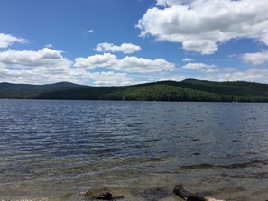 A lake with clear water, surrounded by green hills and a partly cloudy sky. - Upscale Mount Snow/Stratton Area w/Indoor Pool access, short drive to lakes  (West Wardsboro)