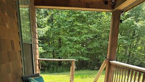 A wooden deck with wicker furniture and a railing. - Upscale Mount Snow/Stratton Area w/Indoor Pool access, short drive to lakes  (West Wardsboro)