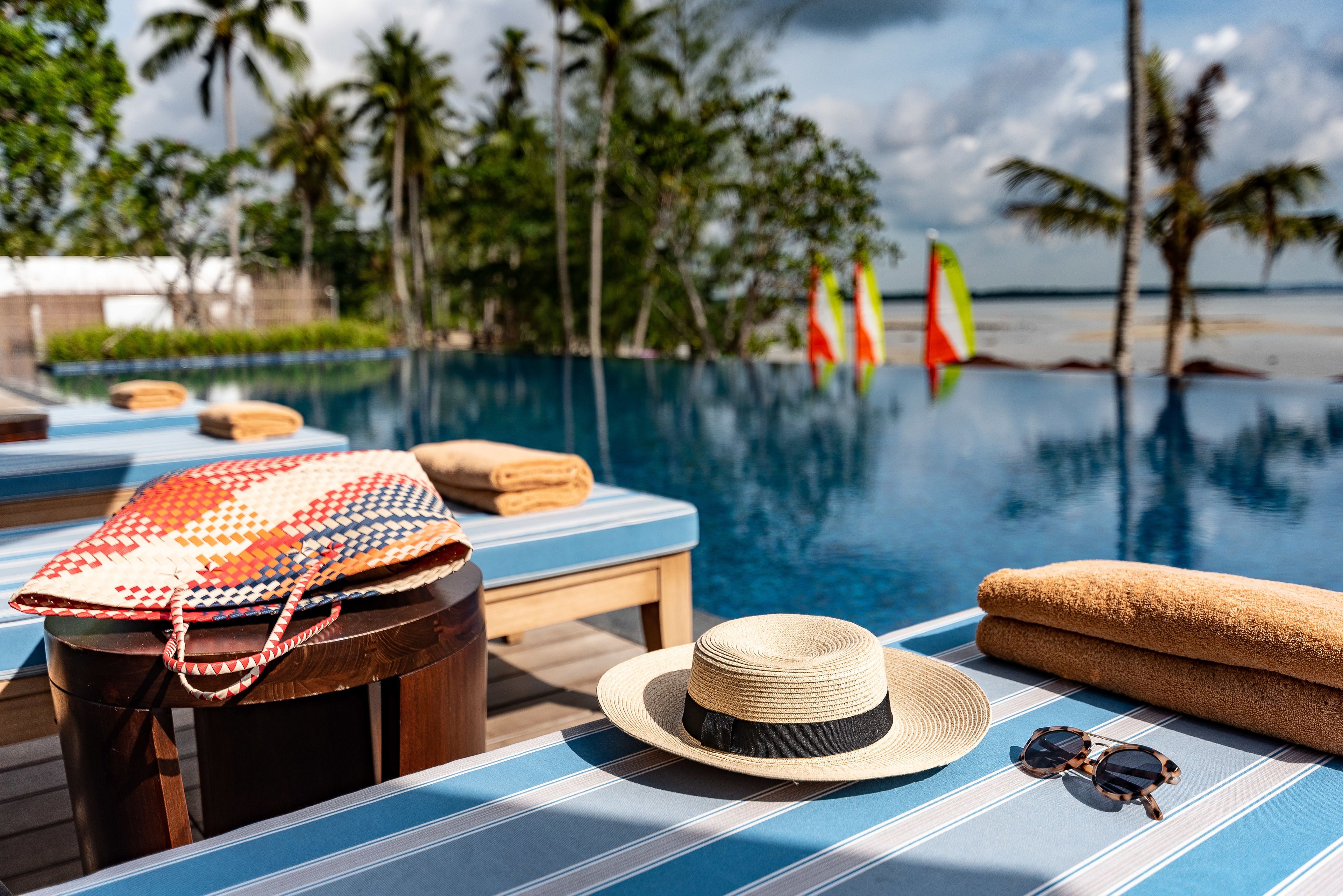 outdoor pool, open 9:00 am to 6:00 pm, pool umbrellas, pool loungers