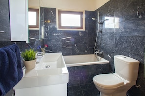 Bathtub, hair dryer, towels