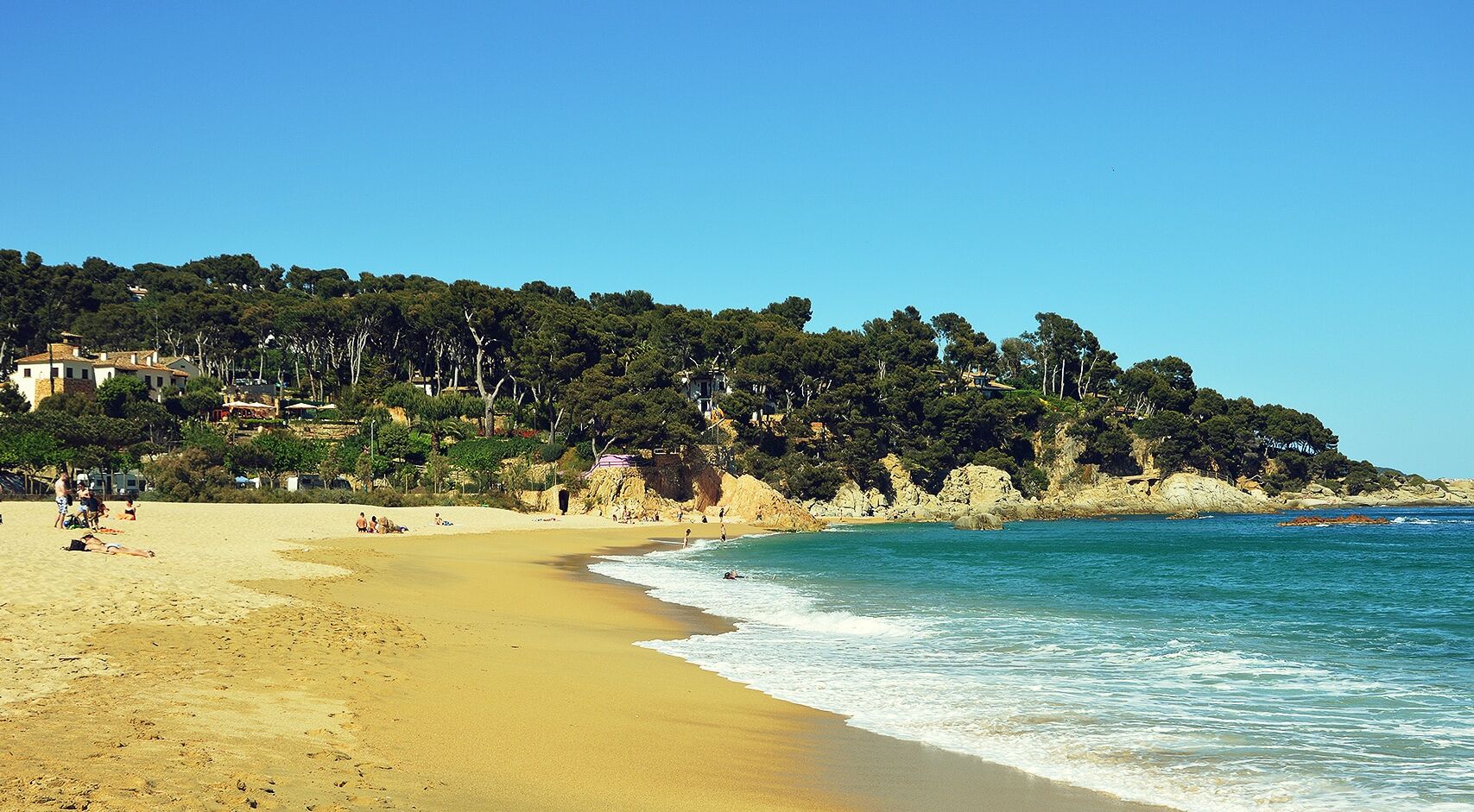 On the beach, sun loungers, beach towels