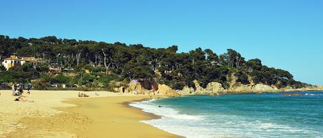 On the beach, sun-loungers, beach towels