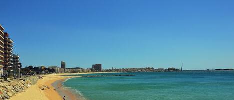 On the beach, sun loungers, beach towels