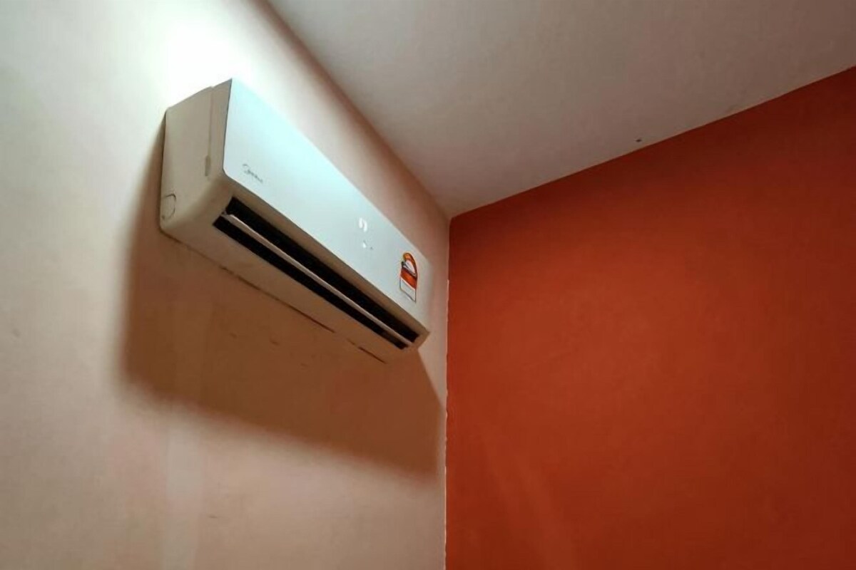 A white air conditioning unit mounted on a wall.