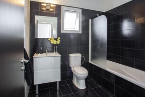 Bathtub, hair dryer, towels