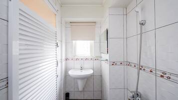 Shower, free toiletries, hair dryer, slippers